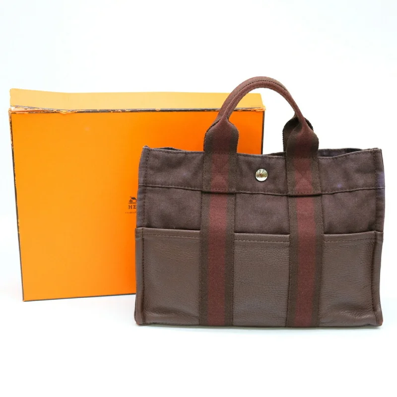 Handle bags with rustic leather for charm -Hermes  Canvas Tote Bag (Pre-Owned)