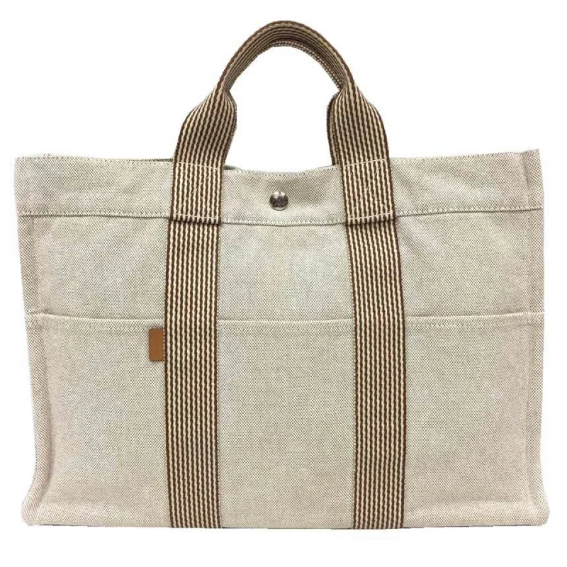 Handle bags with vintage clasps for nostalgia -Hermes Fourre Tout  Ecru  Toile H Tote Bag (Pre-Owned)