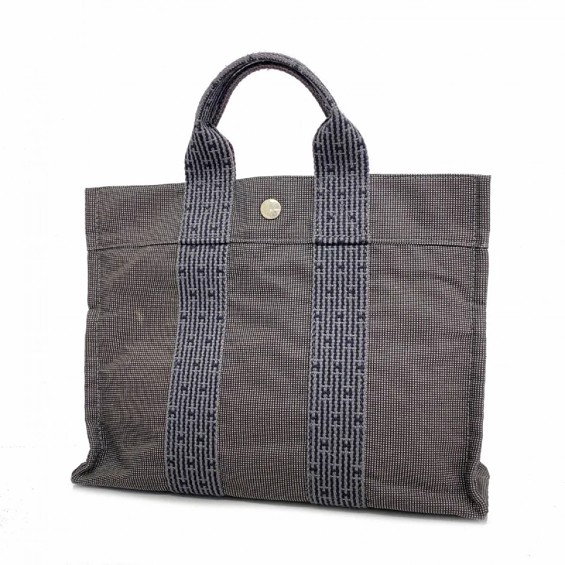 Handle bags with contrast stitching for detail -Hermes  Canvas Tote Bag (Pre-Owned)