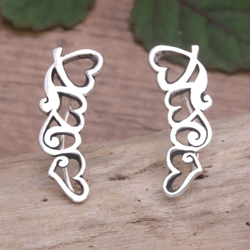 Best hoop earrings with twisted rope designs for a nautical-inspired style-Novica Handmade Climbing Hearts Sterling Silver Ear Climber Earrings