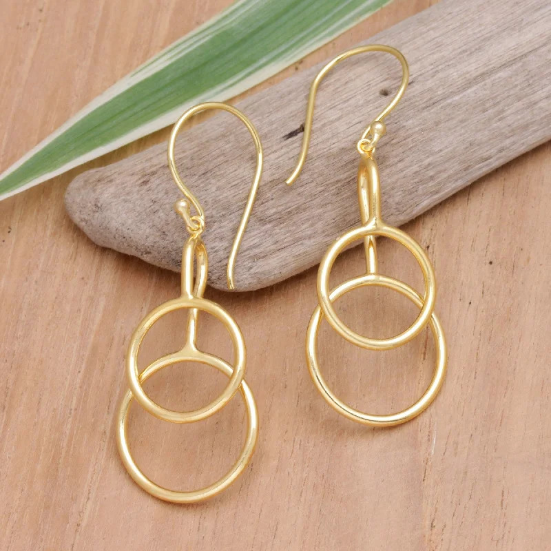 Best hoop earrings with cubic zirconia for a budget-friendly, dazzling look-Novica Handmade Compassion Rings Gold-Plated Dangle Earrings