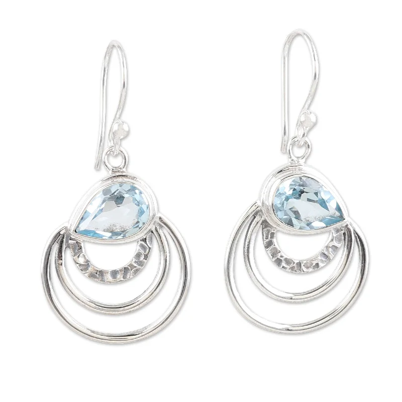 Hoop earrings with a chunky design for a bold and trendy statement-Novica Handmade Loyal Orbits Blue Topaz Dangle Earrings